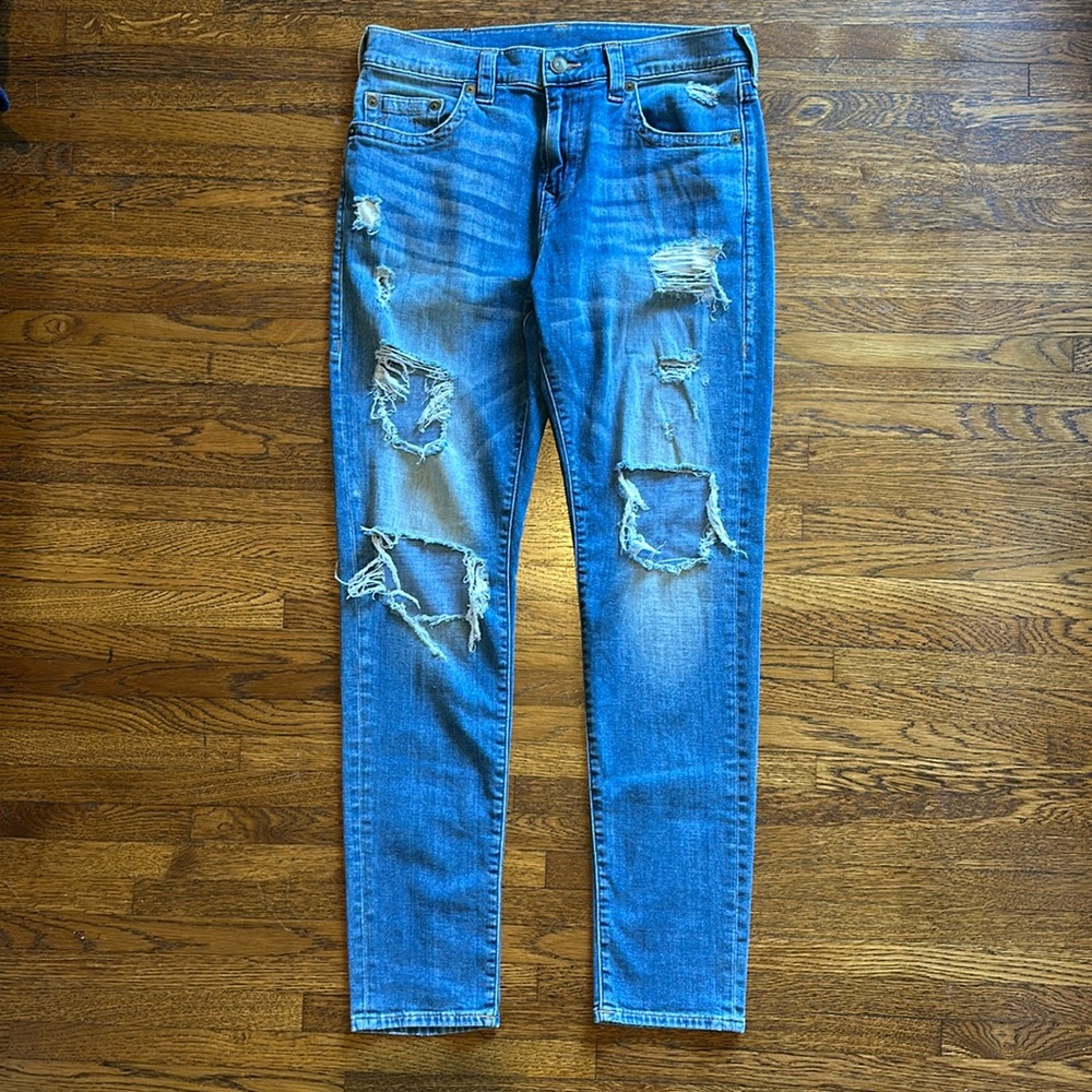 True Religion Men’s Blue Stretch Cotton Destroyed Slim Logan Fit Jeans